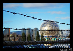 Science World through barbed wire fence
