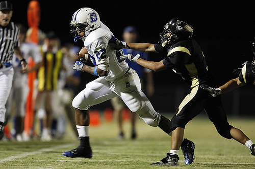 Davis High Pioneer Football Williams by Wayne Tilcock, Davis High's Courtney Williams works the sideline during the Blue Devils' comeback attempt at Pionee