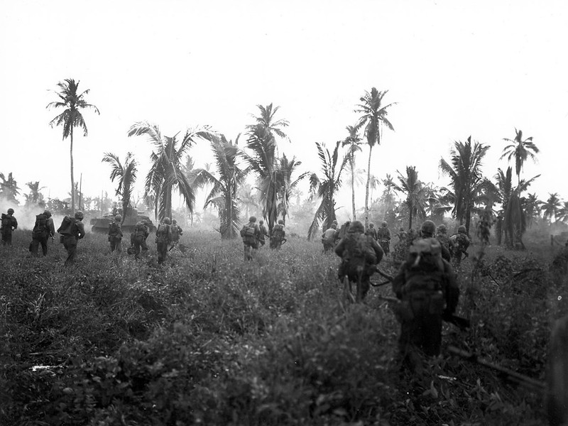 U.S. Military ground troops advance through a jungle to reclaim Guam, 1944.

Andersen Air Force Base