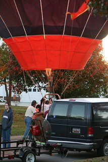 Hot air balloon landing on the main entrance of a subdivision at sunset in Lexington, SC