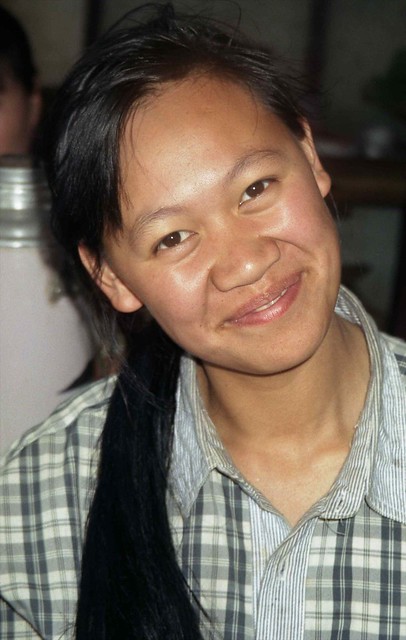 Smiling woman; Menghum, Xishuangbanna, Yunnan, China