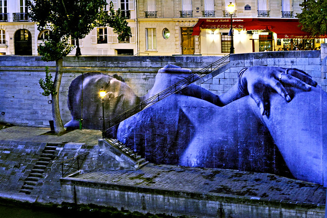 Sreet Art. Paris (France). Street Art. Giant Paste-up in Paris. Collage JR. Un enfant va naître …