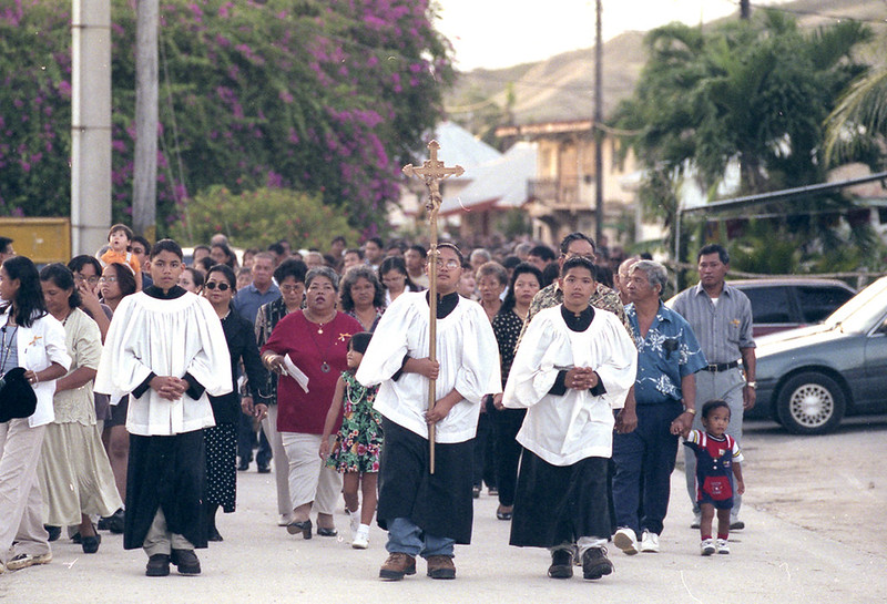 Altar servers lead people in a procession in honor of village patron saint, St Joseph.

Victor Consaga/Guampedia