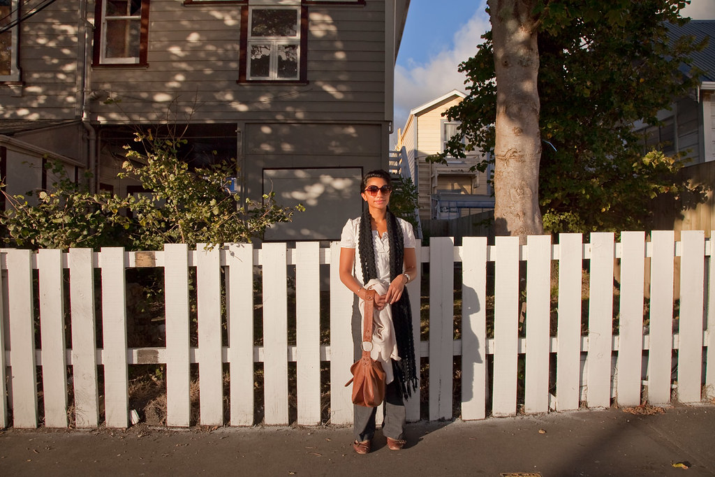young woman, picket fence by Lester Ralph Blair