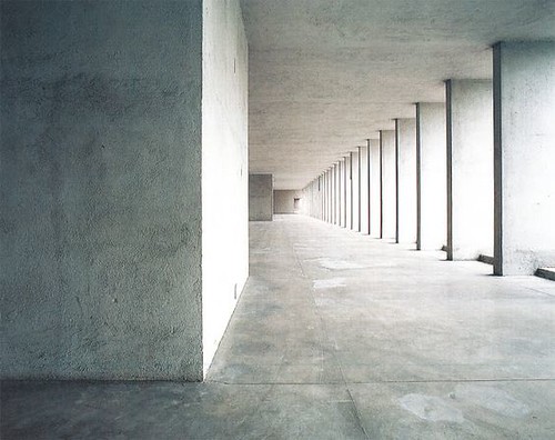 Aldo Rossi, Quartiere residenziale Gallaratese, Milan, Italy, 1967-74: A hallway made of stone, mimics a parking garage. 