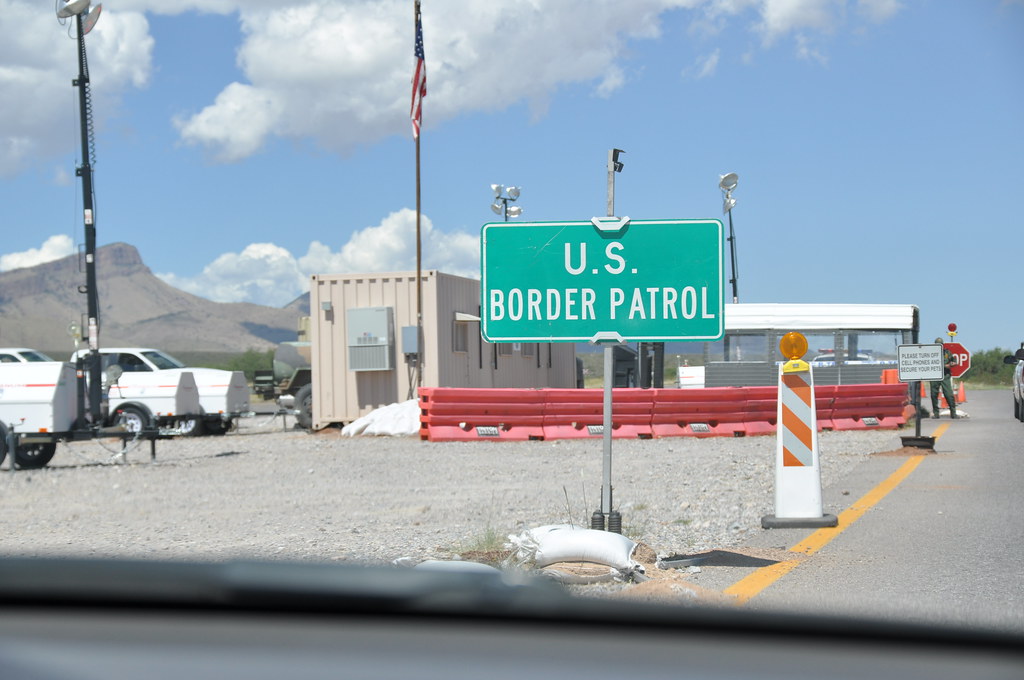 Immigrant Crossing Road Sign