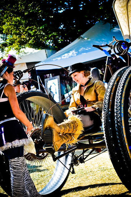 Maker Faire : Girls taking a rest on thier Bigwheel