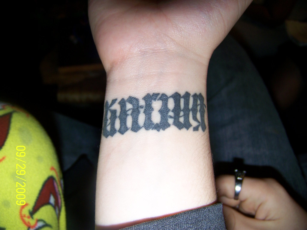 Remember this “betsy” ambigram tattoo?! She came back and made it a wrap  around band! This tattoo looks the same right side up AND up... | Instagram