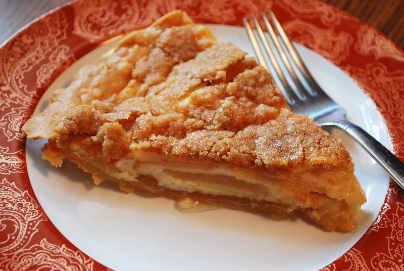 Apple Custard Pie - layers of cinnamon apples, creamy custard, and a streusel topping. The perfect Thanksgiving apple pie!
