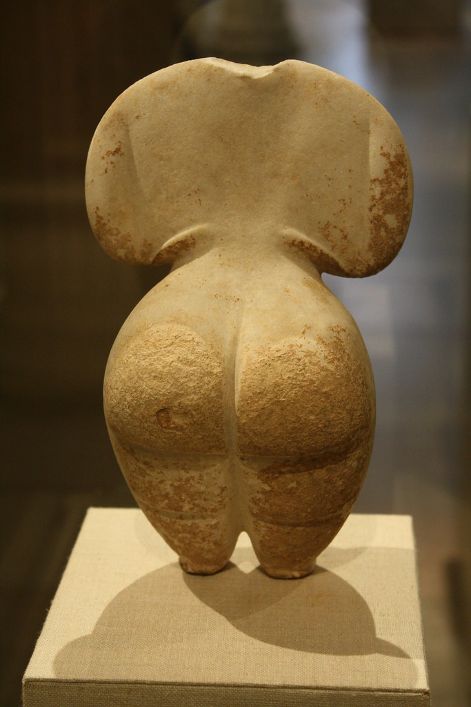A Highly Important Neolithic Cycladic Female Standing Marble Idol of Steatopygous Type