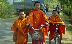 Monks on bicycles; S Xishuangbanna, Yunnan, China