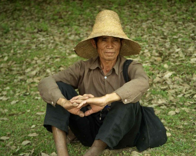 Man with typical Dai hat; S Xishuangbanna, Yunnan, China