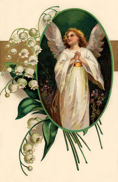 Easter angel surrounded by Lily of the Valley flowers