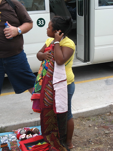 Woman selling Kuna goods near dock, Panama