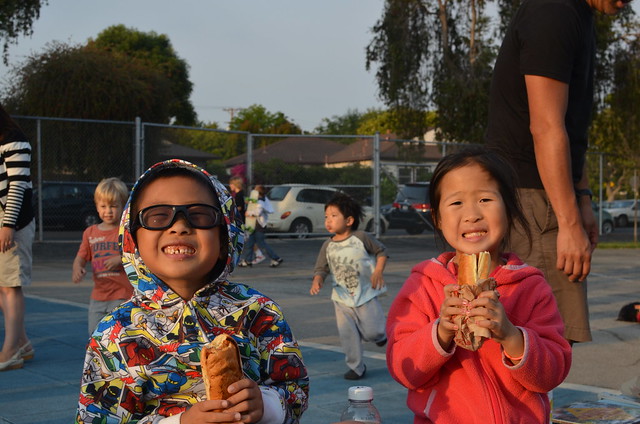 Aki and Owen having hot dogs at the Mar Vista Elementary fair