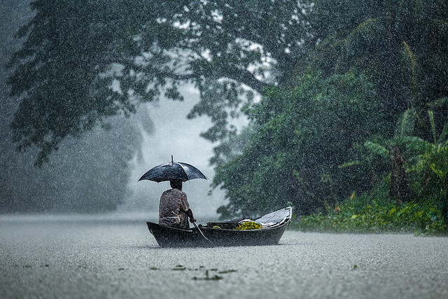 Boatman in rain