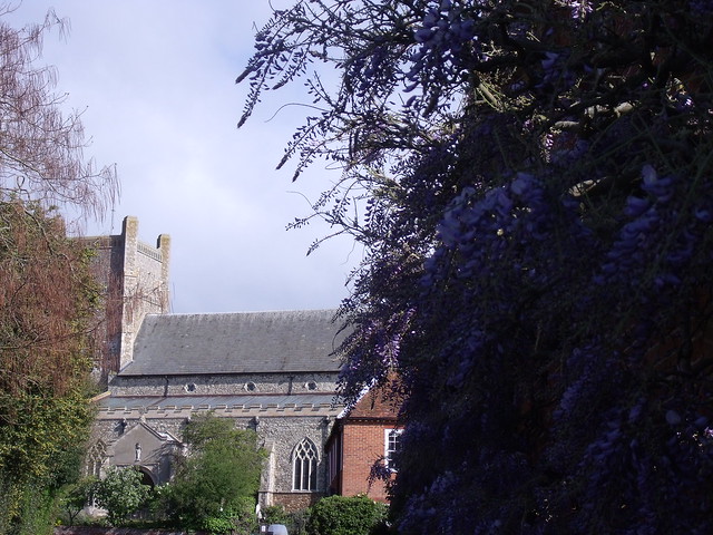 St Bartholomew's church, and wisteria on cottage wall