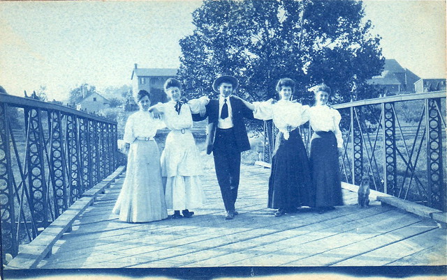 Four women, one man, and a dog, circa 1906