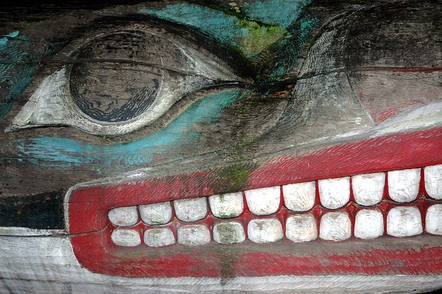 Detail: Killer Whale (Orca) dorsal fin, eye, nose, mouth, lips, teeth, face, carved wood, totemic design, weathered, paint, University of Washington, U District, Seattle, Washington, USA
