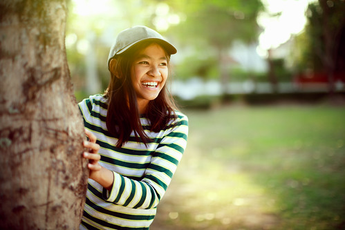 outdoor sunlight tree thailand model fun attractive park green white spring teenage sunny tone light summer outside sun female portrait smile thai youth lifestyle healthy girl young color laughing person beauty sunset joyful hair joy beautiful background nature teen pretty little asian happy copyspace