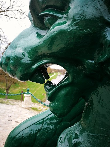 lion statue thru sculpture briare canal art head mouth landscape perspective