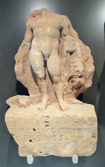 Relief in bright sandstone depicting naked Hercules with lion's skin over his left arm and his right hand resting on a club, Museum Schloss Fechenbach, Dieburg, Germany