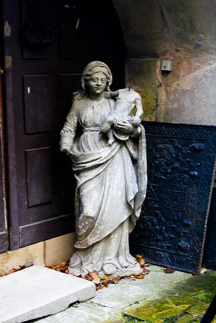 Sad little statue in a sad little church, France