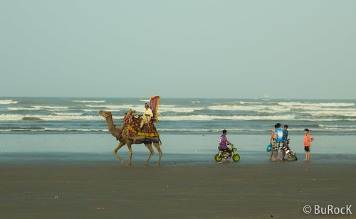 morning sea sun beach boys bike camel karachi seaview