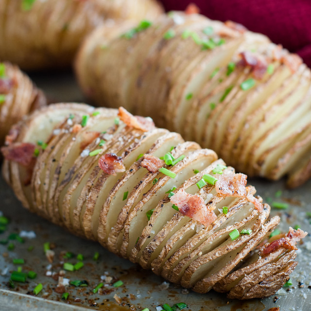 Hasselback potatoes with bacon bits.