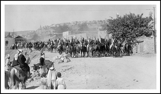 Emir Saud's visit to Emir Abdullah in Amman. Bedouin cavalcade riding through streets of Amman - 1935