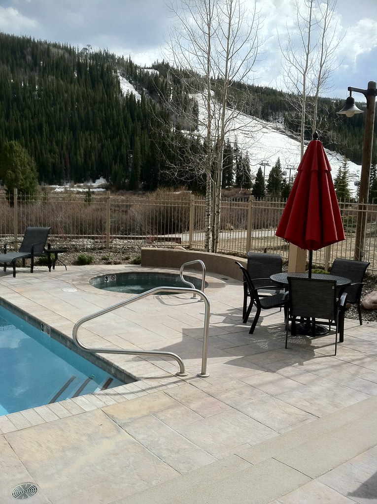 Heated pool with two hot tubs