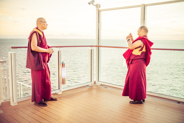 Monks Taking Mobile Photos On A Cruise