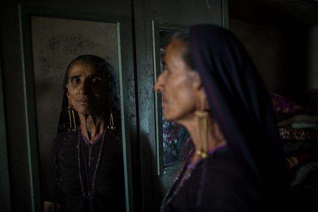 Rabari woman in the mirror with tattoos in the great rann of kutch
