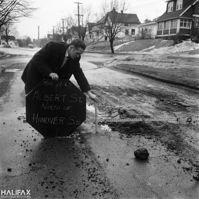 Measuring potholes, Albert St. north of Hanover St.