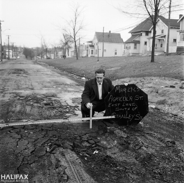 Measuring potholes, Agricola St., East Lane, South of Stanley St.