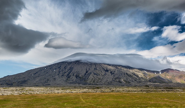 Clouds caressing the lava mountain