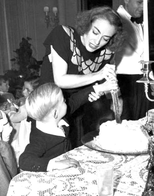 Joan Crawford kills - oops, CUTS the birthday cake .