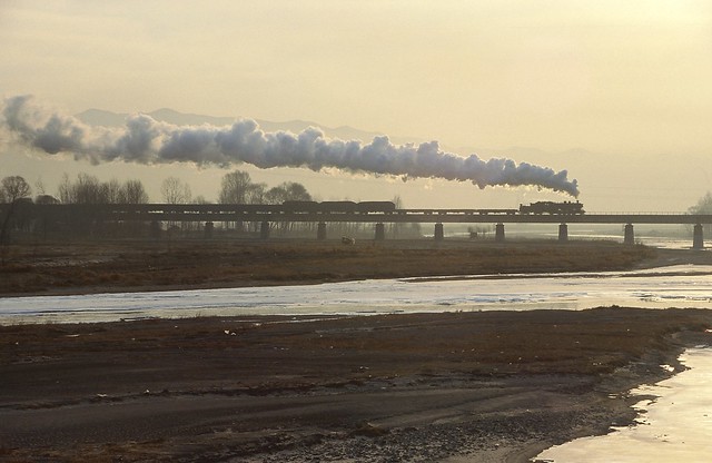 SY0532 crosses the Luanhe River Bridge.  Hebei Province, Peoples Republic of China. 19th February, 2002.