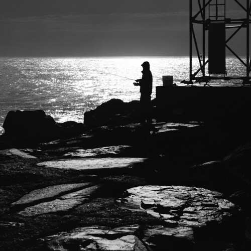 Fisherman by Dalliance with Light (Andy Farmer), jersey ocean rocks silhouette fisherman water fishing nj channel bw belmar landscape shore newjersey