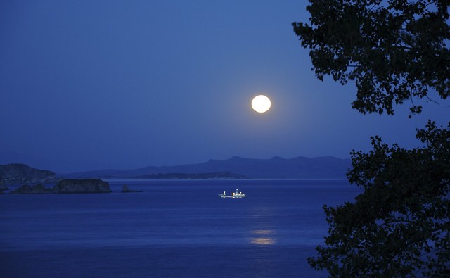 Ship Passing Through the Islands at Night