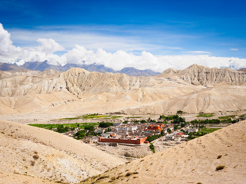 city blue nepal sky brown green nature clouds contrast landscape outdoors town asia village desert capital scenic dry nobody nopeople scene hills oasis mustang himalaya arid walledcity restrictedarea uppermustang lomanthang annapurnaconservationarea