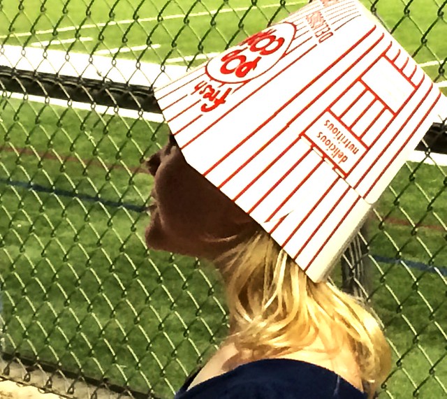 The world is a very special place when you have a popcorn carton hat :)
