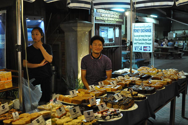 A local selling delicious cakes at the night market