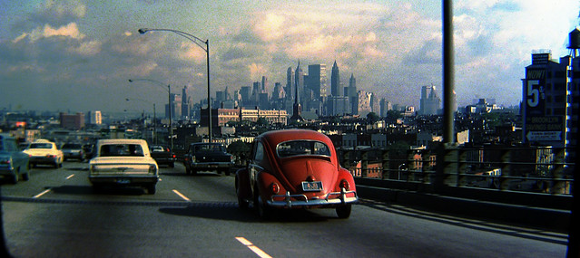 Cruising the highways of Brooklyn in my dad's 1953 Pontiac Chieftan. Old brownstowns on the street at right and the towering skyline of Lower Manhattan in the distance. New York. Aug 1969