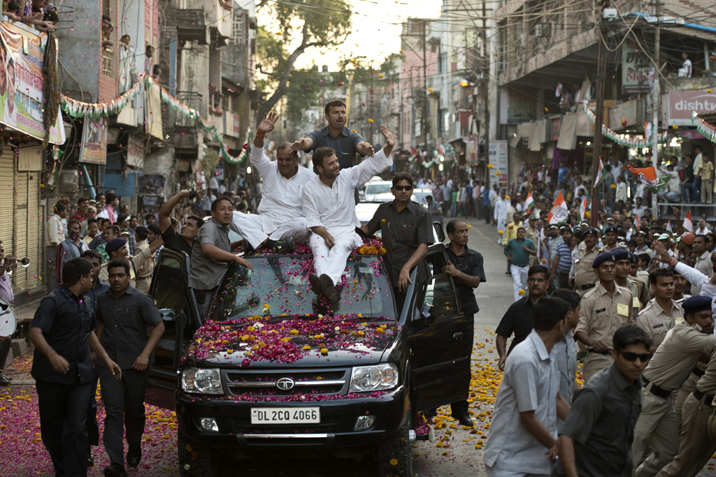 For votes Rahul Gandhi drives through Gwalior with Ashok Singh.