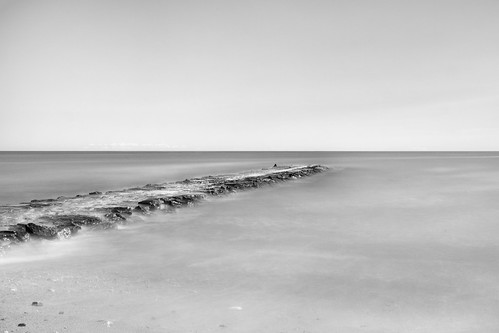 ocean longexposure sea blackandwhite seascape monochrome landscape pier rocks jetty rhodeisland le blockisland