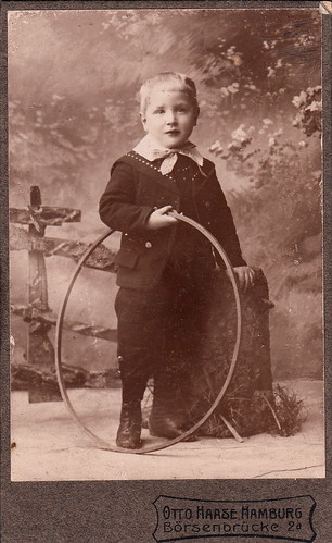 Portrait of a young boy with a hoop by Otto Haase (undated… | Flickr