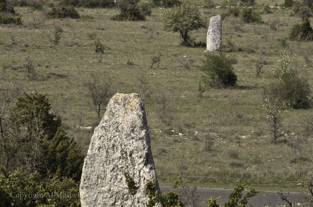 Menhir de la Cisternette looks down on the Menhir du Coulet