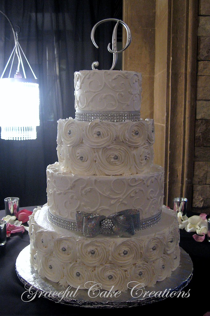 Elegant Silver and White Wedding Cake with Rosettes