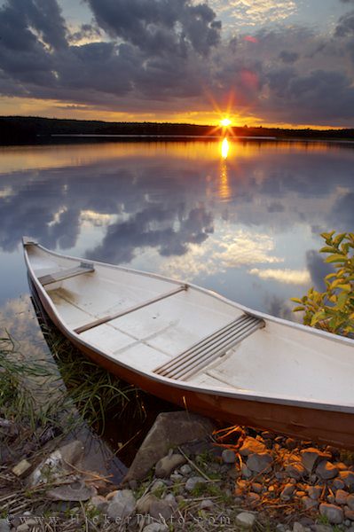 Canoe on a lake at sunset Nova Scotia Canada